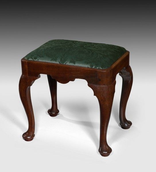 An early George II period mahogany cabriole leg stool. An early George II period mahogany cabriole leg stool.